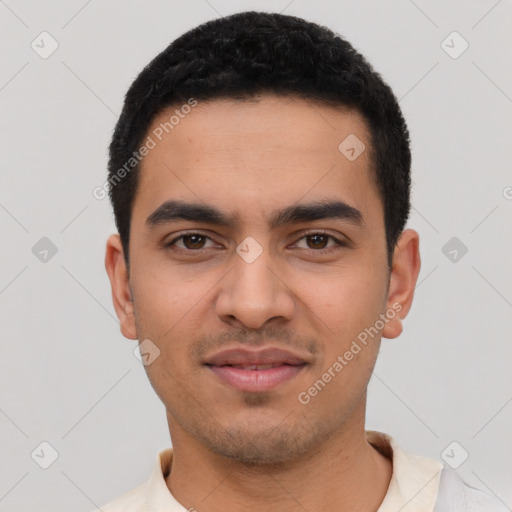 Joyful latino young-adult male with short  black hair and brown eyes