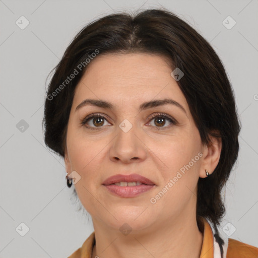 Joyful white adult female with medium  brown hair and brown eyes