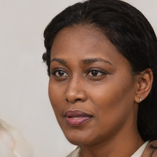 Neutral black young-adult female with medium  black hair and brown eyes