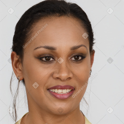 Joyful black young-adult female with long  brown hair and brown eyes