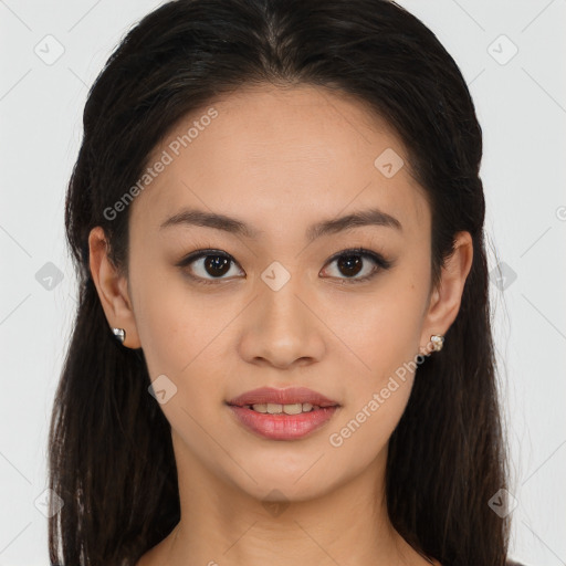 Joyful latino young-adult female with long  brown hair and brown eyes