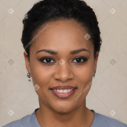 Joyful black young-adult female with short  black hair and brown eyes