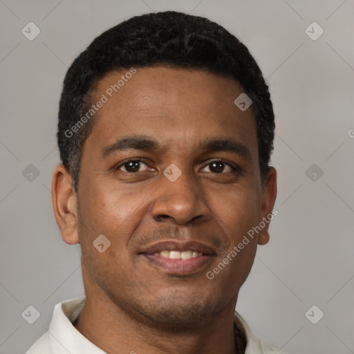 Joyful latino young-adult male with short  brown hair and brown eyes