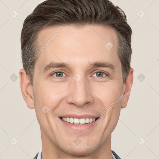 Joyful white adult male with short  brown hair and grey eyes