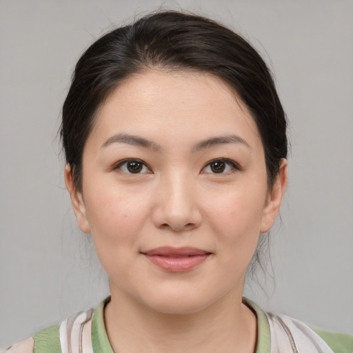 Joyful white young-adult female with medium  brown hair and brown eyes