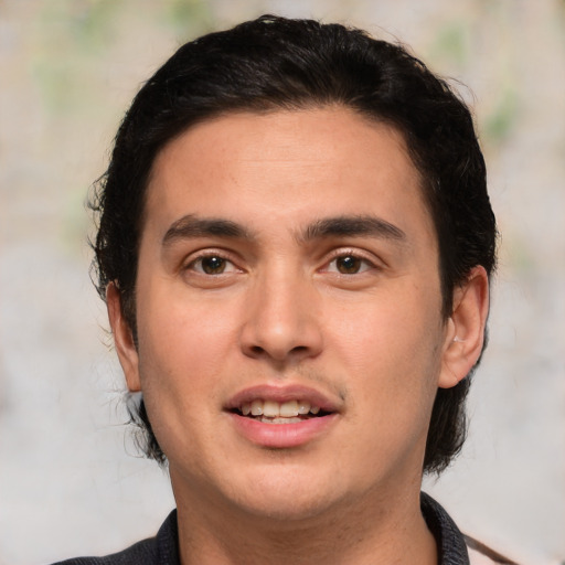 Joyful white young-adult male with medium  brown hair and brown eyes