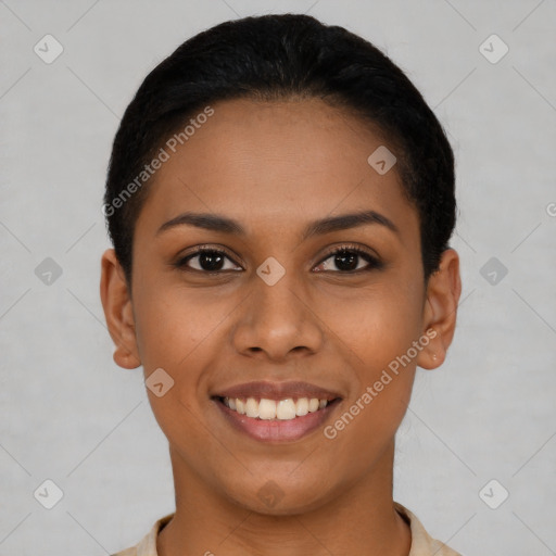 Joyful latino young-adult female with short  black hair and brown eyes