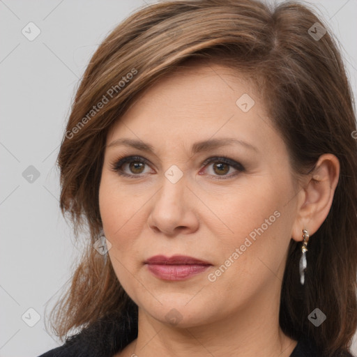 Joyful white adult female with medium  brown hair and brown eyes