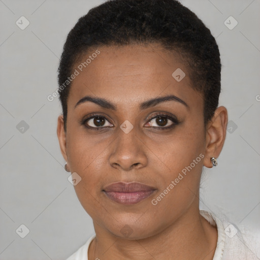 Joyful black young-adult female with short  brown hair and brown eyes