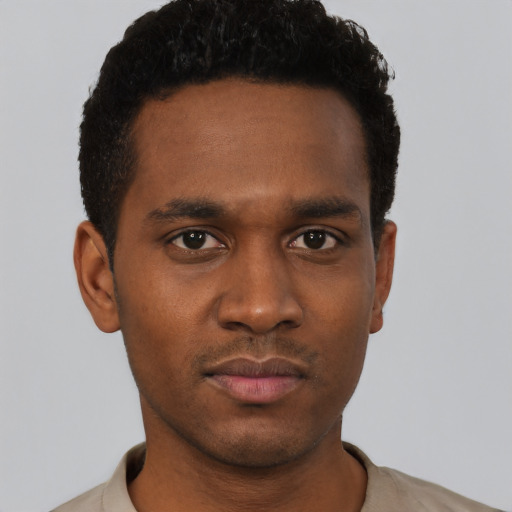 Neutral black young-adult male with short  black hair and brown eyes
