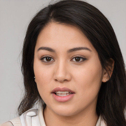Joyful white young-adult female with long  brown hair and brown eyes