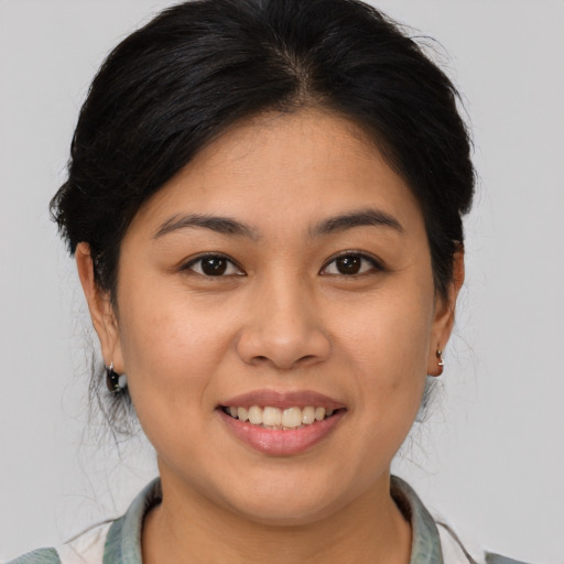 Joyful white young-adult female with medium  brown hair and brown eyes