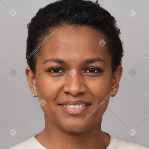 Joyful black young-adult female with short  black hair and brown eyes