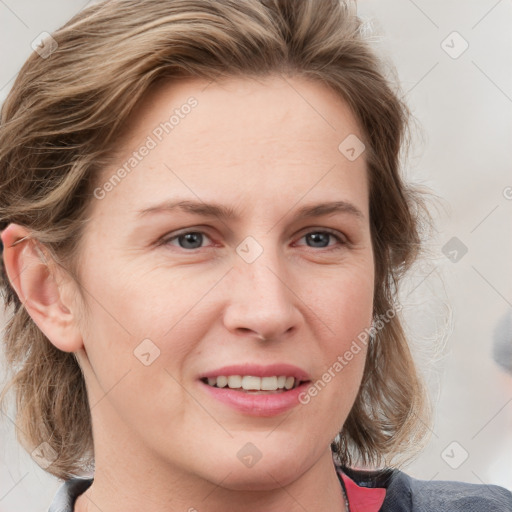 Joyful white young-adult female with medium  brown hair and blue eyes