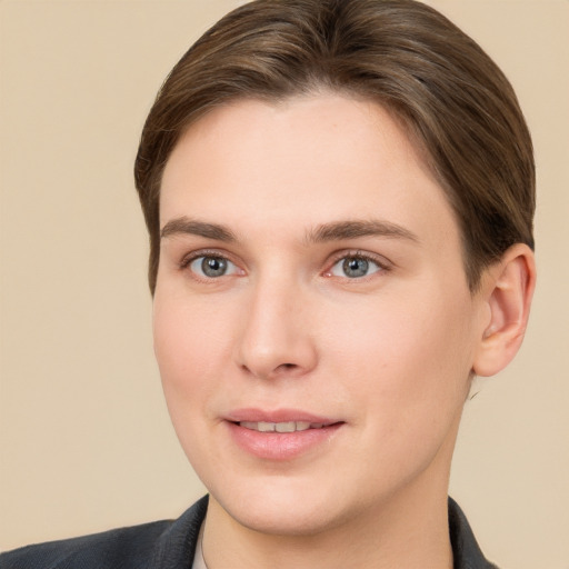 Joyful white young-adult female with short  brown hair and grey eyes