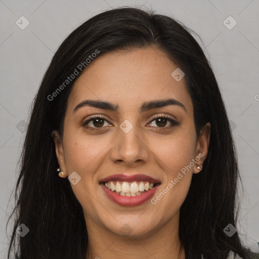 Joyful latino young-adult female with long  brown hair and brown eyes