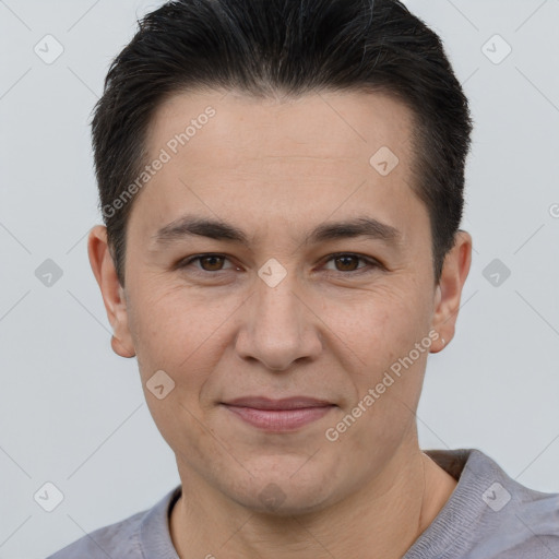 Joyful white adult male with short  brown hair and brown eyes