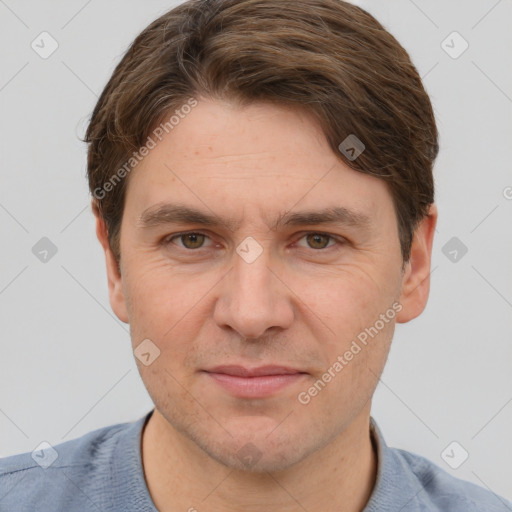 Joyful white adult male with short  brown hair and brown eyes