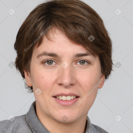 Joyful white young-adult female with short  brown hair and grey eyes