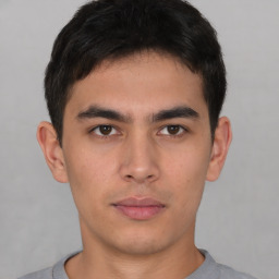 Neutral asian young-adult male with short  brown hair and brown eyes