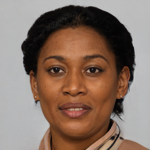 Joyful black adult female with short  brown hair and brown eyes