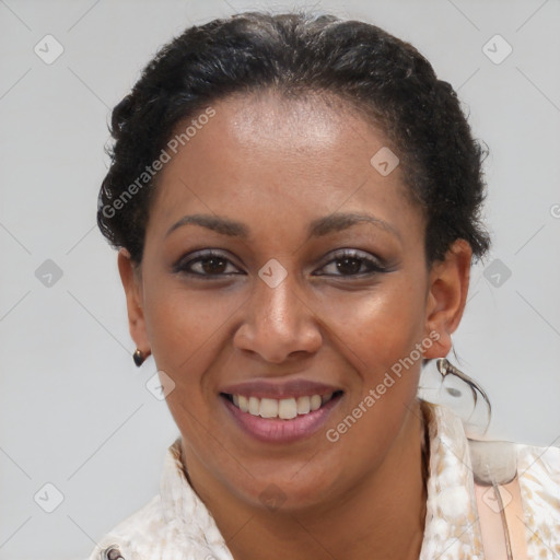 Joyful black adult female with medium  brown hair and brown eyes