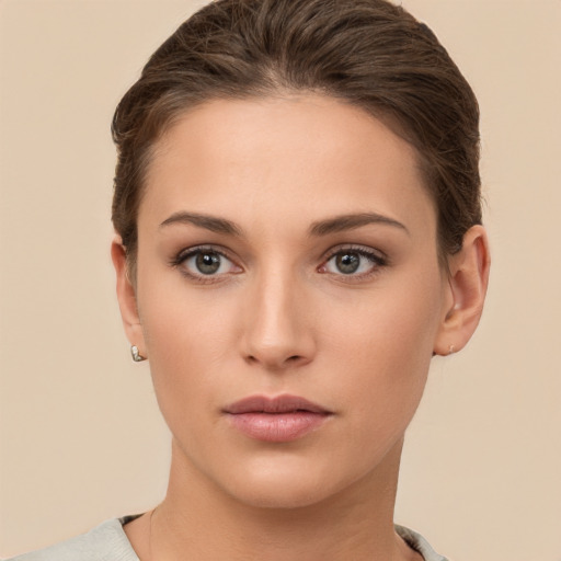 Neutral white young-adult female with short  brown hair and brown eyes