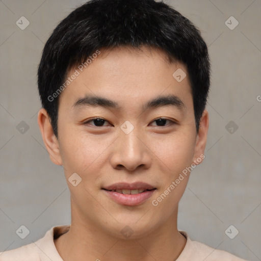 Joyful asian young-adult male with short  brown hair and brown eyes