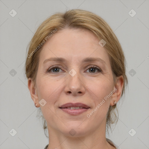 Joyful white adult female with medium  brown hair and grey eyes