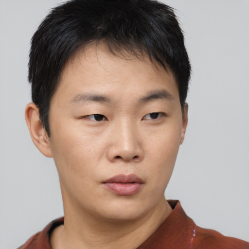 Neutral asian young-adult male with short  brown hair and brown eyes
