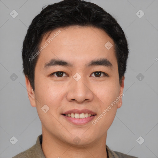 Joyful asian young-adult male with short  black hair and brown eyes