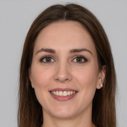 Joyful white young-adult female with long  brown hair and grey eyes