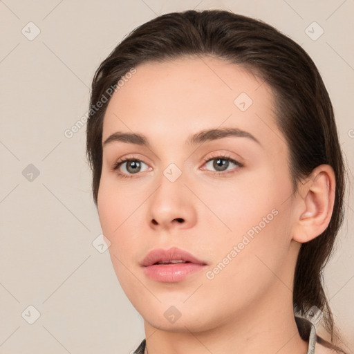 Neutral white young-adult female with medium  brown hair and brown eyes