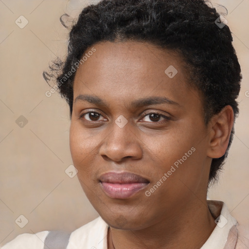 Joyful black young-adult female with short  brown hair and brown eyes