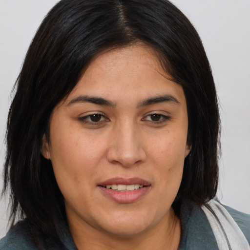 Joyful asian young-adult female with medium  brown hair and brown eyes