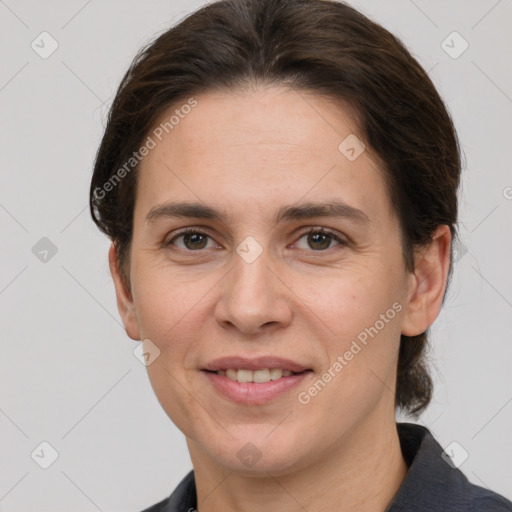 Joyful white adult female with short  brown hair and brown eyes