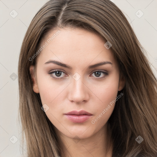 Neutral white young-adult female with long  brown hair and brown eyes