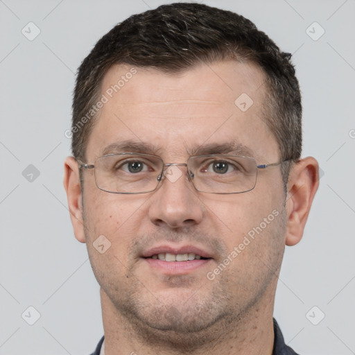 Joyful white adult male with short  brown hair and brown eyes