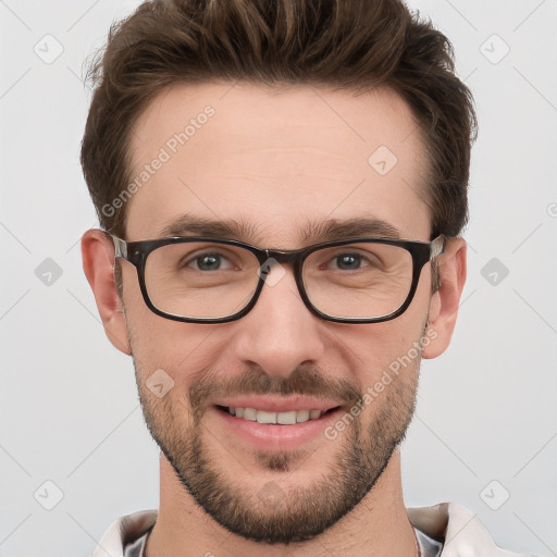 Joyful white young-adult male with short  brown hair and grey eyes