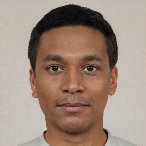 Neutral black young-adult male with short  black hair and brown eyes