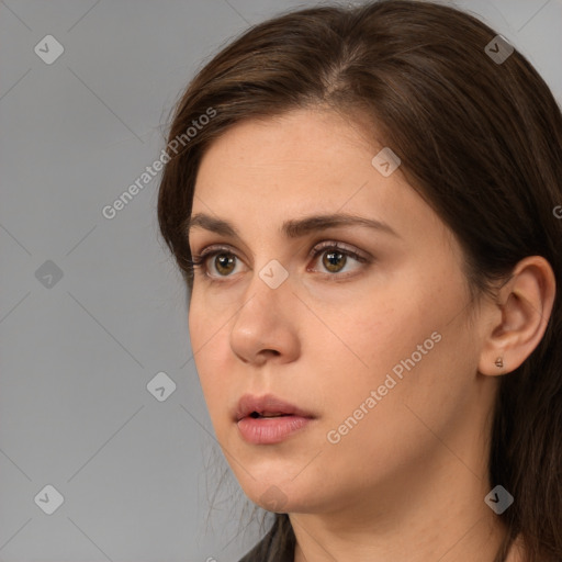 Neutral white young-adult female with long  brown hair and brown eyes