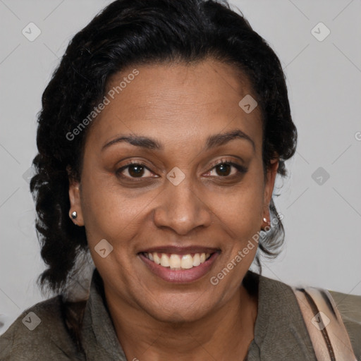 Joyful black adult female with short  brown hair and brown eyes