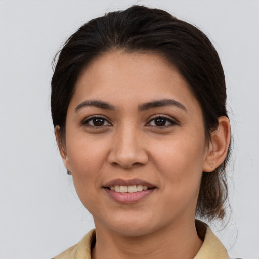 Joyful white young-adult female with medium  brown hair and brown eyes