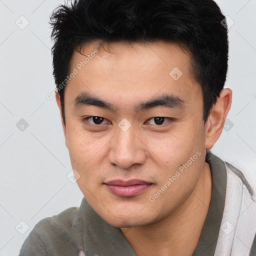 Joyful latino young-adult male with short  brown hair and brown eyes