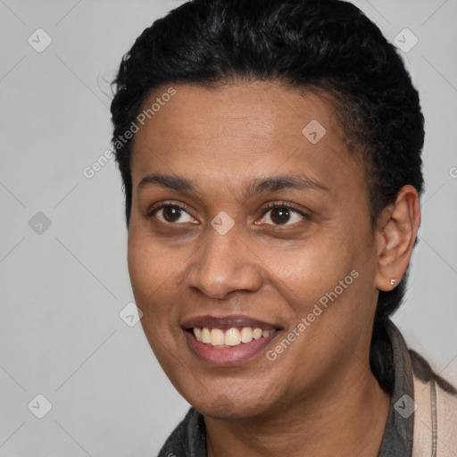 Joyful black adult female with short  brown hair and brown eyes