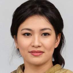 Joyful asian young-adult female with medium  brown hair and brown eyes