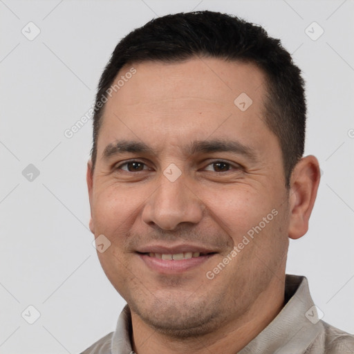 Joyful white adult male with short  brown hair and brown eyes