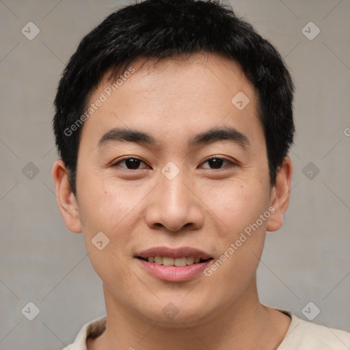 Joyful asian young-adult male with short  brown hair and brown eyes