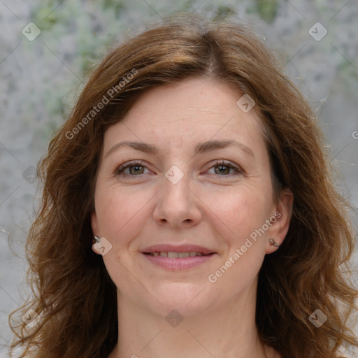 Joyful white adult female with long  brown hair and grey eyes