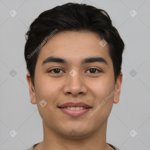 Joyful asian young-adult male with short  brown hair and brown eyes